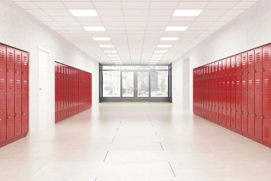A large room with red lockers and white walls.